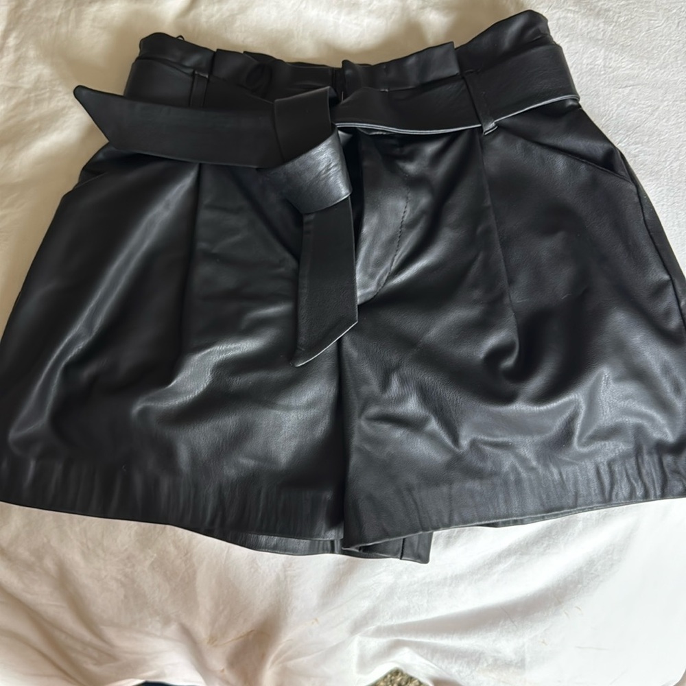black pleather trash bag waist shorts